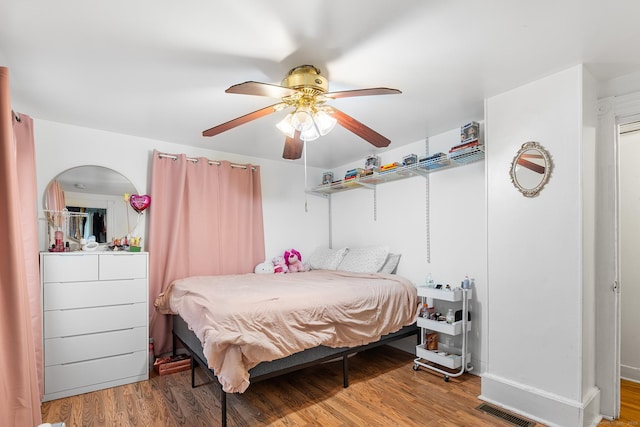 77 Cedar St, Norwalk, CT 06854 - bedroom with wood finished floors, a ceiling fan, and baseboards