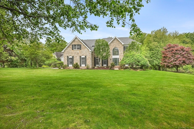 260 Range Rd, Fairfield, CT 06890 - view of front of home featuring stone siding, a front lawn, and brick siding