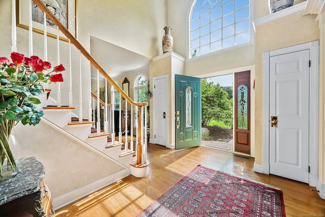 260 Range Rd, Fairfield, CT 06890 - entrance foyer featuring a high ceiling, wood finished floors, and stairway