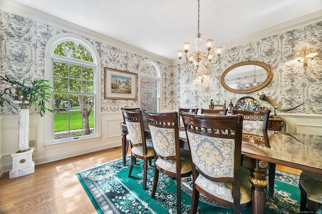 260 Range Rd, Fairfield, CT 06890 - dining area with wallpapered walls, a chandelier, wood finished floors, a wainscoted wall, and ornamental molding