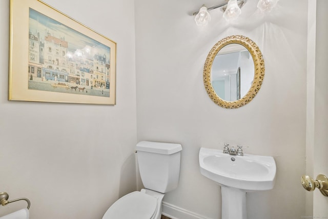 260 Range Rd, Fairfield, CT 06890 - bathroom with toilet, baseboards, and a sink