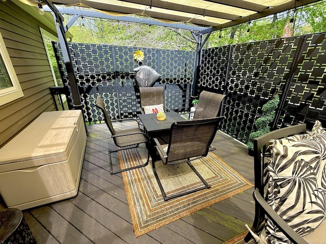 wooden deck featuring outdoor dining area