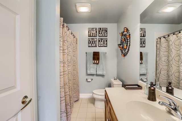 full bath with tile patterned flooring, toilet, vanity, and baseboards