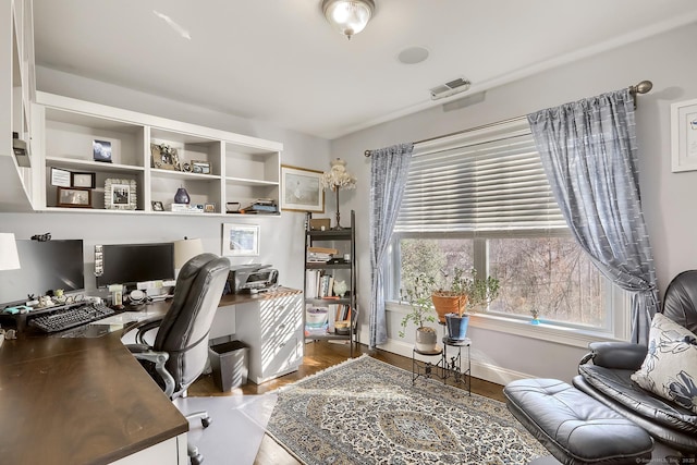 office space with wood finished floors and baseboards