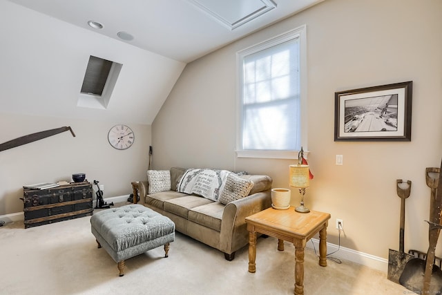 sitting room featuring light carpet, baseboards, lofted ceiling, and attic access