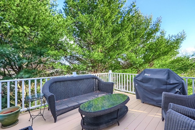 deck featuring grilling area and outdoor lounge area