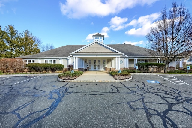view of building exterior featuring uncovered parking