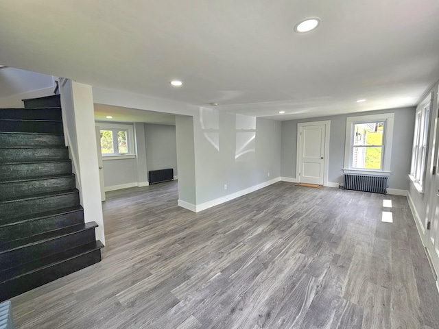 1 Arlington Hts, Norwich, CT 06360 - below grade area featuring radiator heating unit, recessed lighting, baseboards, stairs, and wood finished floors