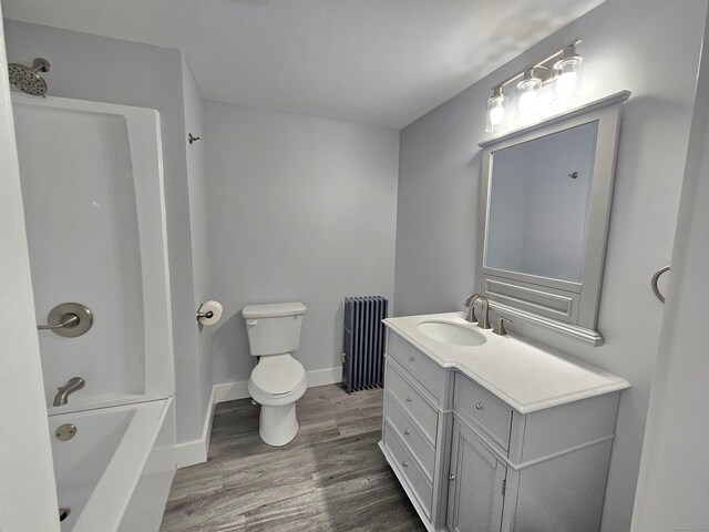 1 Arlington Hts, Norwich, CT 06360 - bathroom with radiator, wood finished floors, toilet, vanity, and bathtub / shower combination