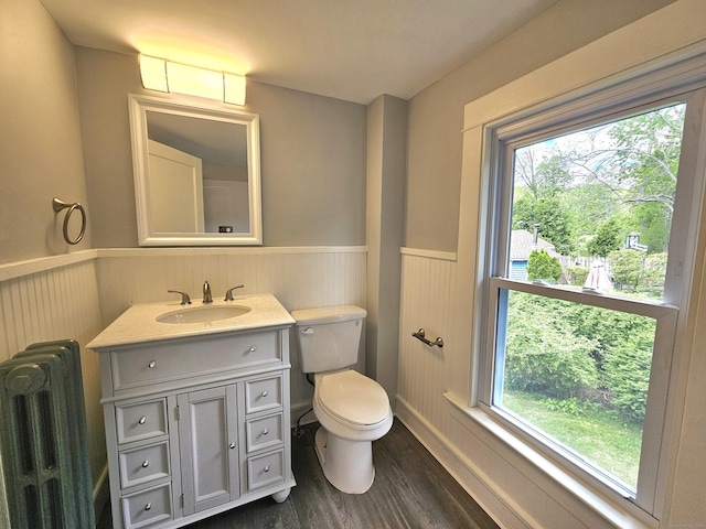 1 Arlington Hts, Norwich, CT 06360 - bathroom with wood finished floors, a wainscoted wall, plenty of natural light, toilet, and vanity