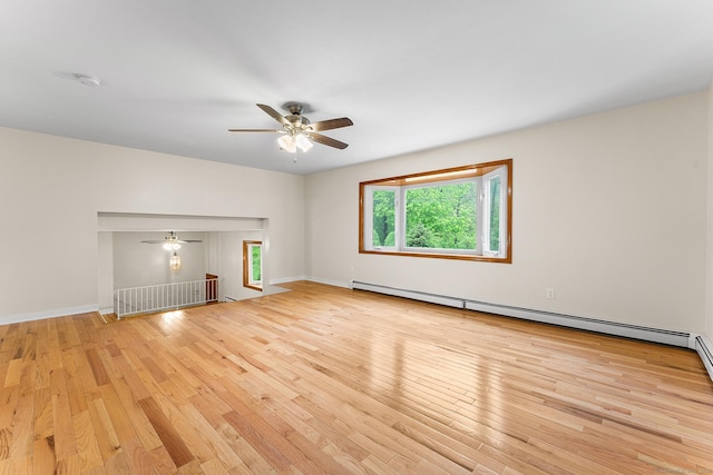 unfurnished living room featuring a ceiling fan, hardwood / wood-style floors, and a baseboard radiator