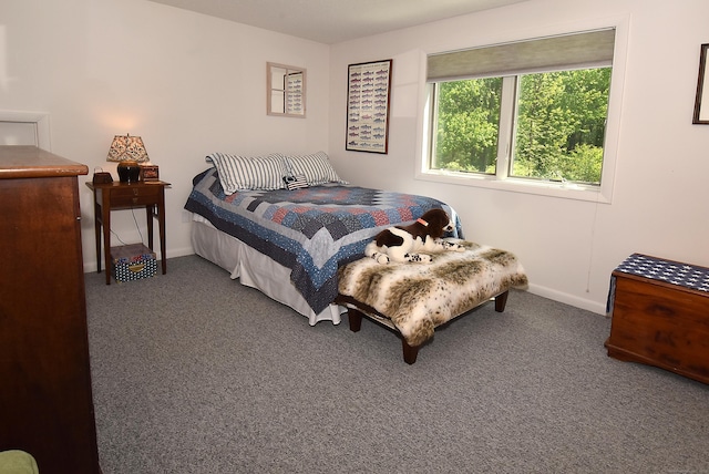 bedroom featuring carpet flooring and baseboards