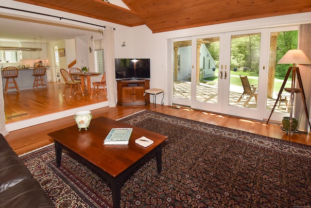 living room featuring wood ceiling, wood finished floors, and french doors