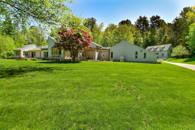 back of house with a yard