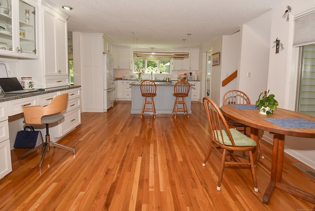 dining space with light wood-style floors