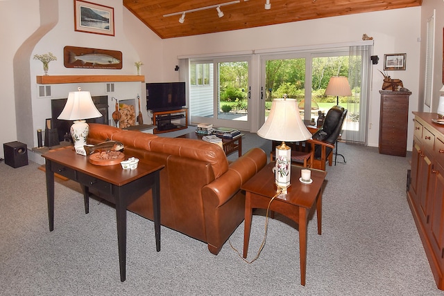 carpeted living area featuring wooden ceiling, healthy amount of natural light, lofted ceiling, and rail lighting