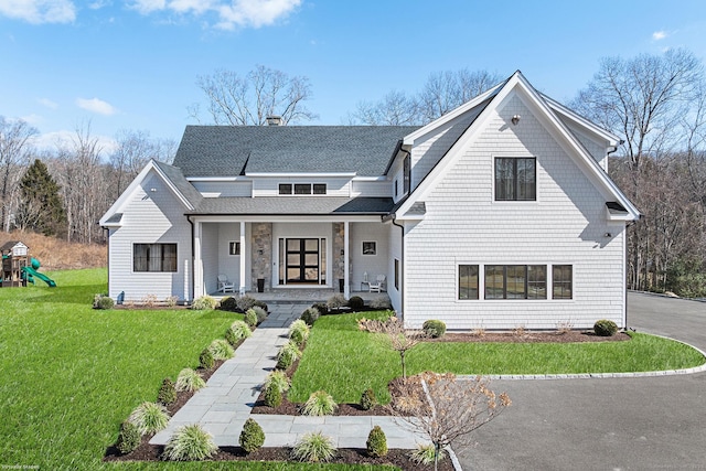 100 Georgetown Rd, Weston, CT 06883 - shingle-style home with covered porch, a front lawn, roof with shingles, and a playground