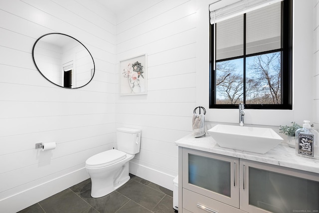 100 Georgetown Rd, Weston, CT 06883 - bathroom with toilet, vanity, tile patterned flooring, and wood walls