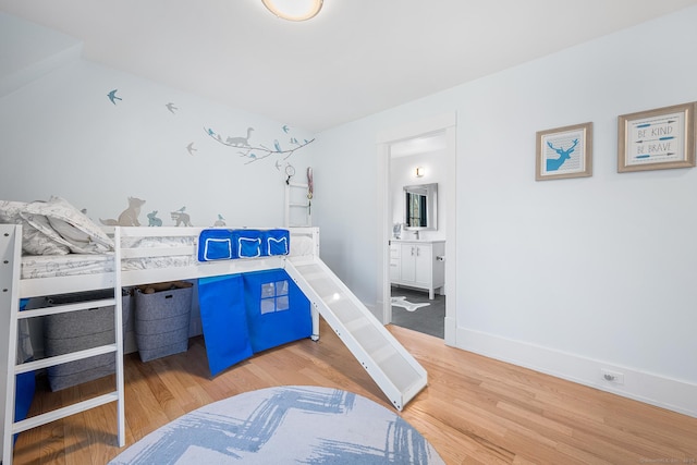 100 Georgetown Rd, Weston, CT 06883 - bedroom with light wood-type flooring, baseboards, and ensuite bathroom
