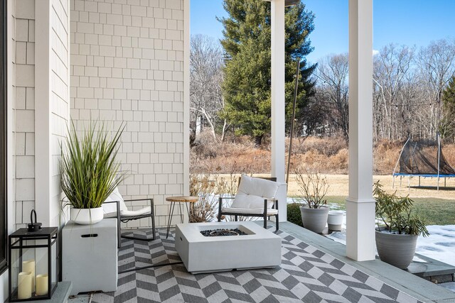 100 Georgetown Rd, Weston, CT 06883 - view of patio / terrace with a trampoline and a fire pit