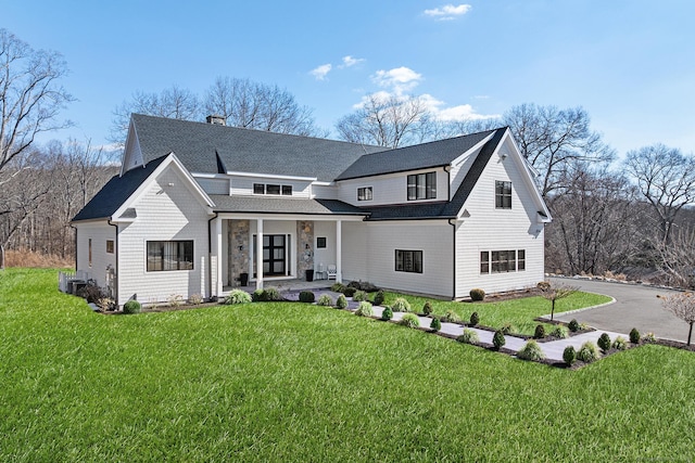 100 Georgetown Rd, Weston, CT 06883 - view of front facade with covered porch, a front lawn, roof with shingles, and a chimney