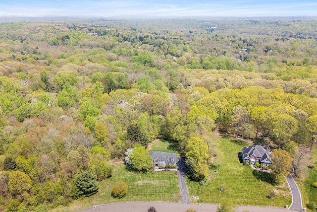 drone / aerial view of a heavily wooded area