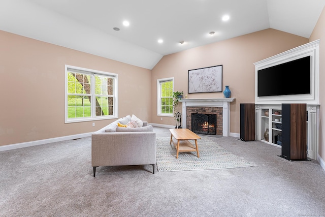 living area featuring lofted ceiling, a brick fireplace, carpet, baseboards, and recessed lighting
