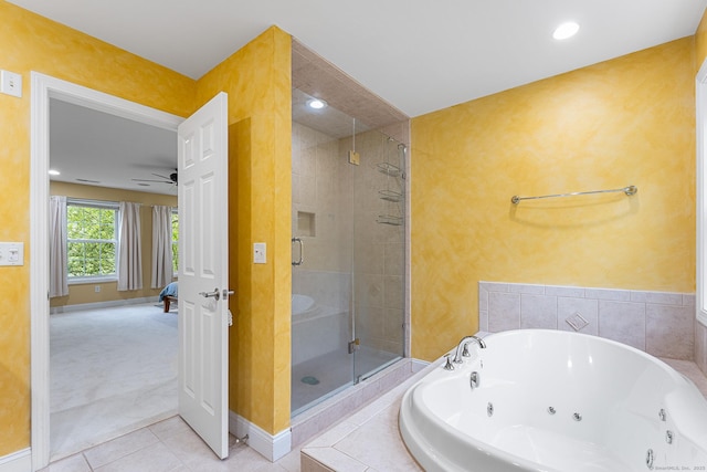 bathroom with a stall shower, a whirlpool tub, baseboards, tile patterned flooring, and a ceiling fan