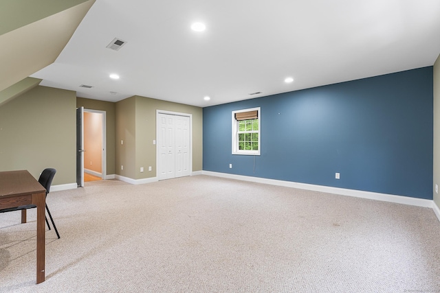 unfurnished office with baseboards, light colored carpet, and recessed lighting