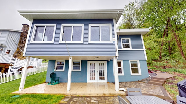 rear view of property featuring french doors and a patio