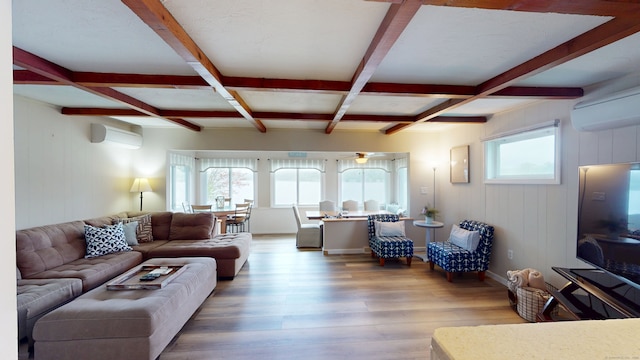 living area with coffered ceiling, beamed ceiling, a wall mounted AC, wood finished floors, and an AC wall unit