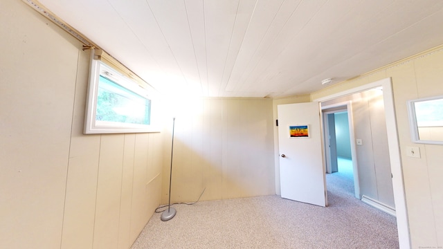 carpeted spare room with a smoke detector
