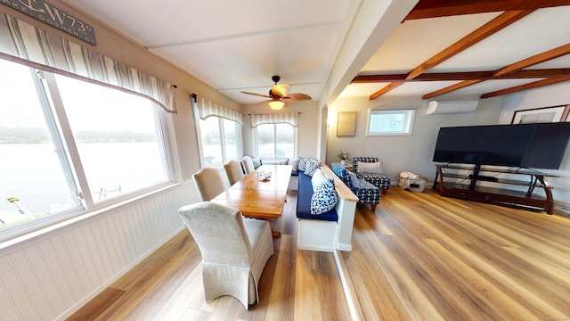dining area with wood finished floors, a wall mounted air conditioner, and ceiling fan