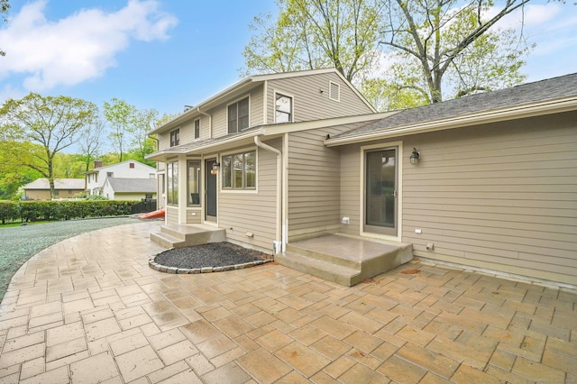 rear view of property featuring a patio area