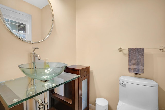 bathroom featuring toilet and a sink