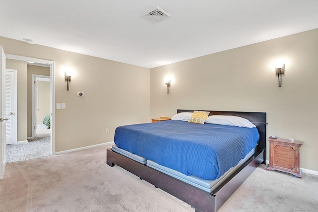 bedroom with carpet flooring and baseboards