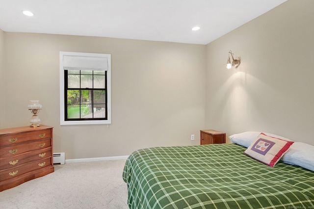 carpeted bedroom featuring a baseboard heating unit, baseboards, and recessed lighting