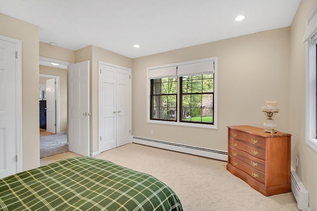 bedroom with a baseboard radiator, light carpet, recessed lighting, and baseboards