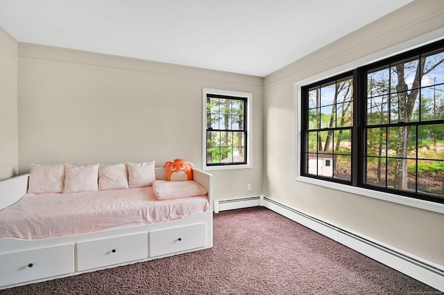bedroom with baseboard heating, multiple windows, and dark carpet