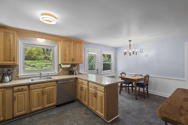 kitchen with stainless steel dishwasher, a sink, a chandelier, tasteful backsplash, and a peninsula