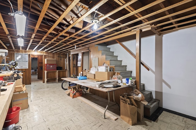 finished below grade area with stairway and wood walls