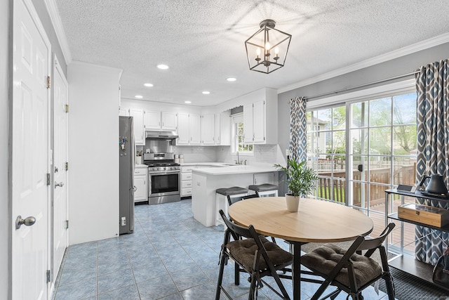 dining area with ornamental molding, a textured ceiling, recessed lighting, a chandelier, and light tile patterned floors