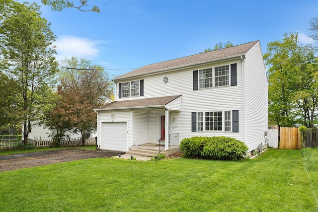 view of front facade featuring asphalt driveway and an attached garage