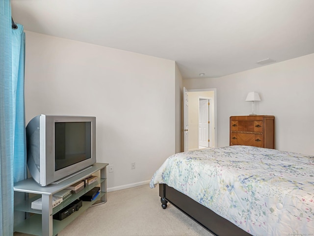 bedroom with carpet flooring and baseboards