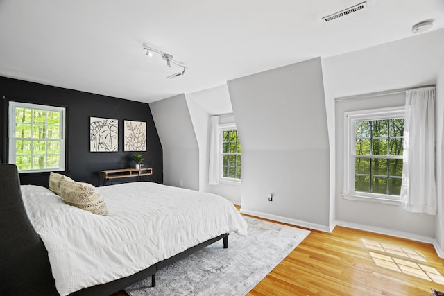 37 Hungry Hill Cir, Guilford, CT 06437 - bedroom featuring light wood-type flooring, baseboards, and track lighting