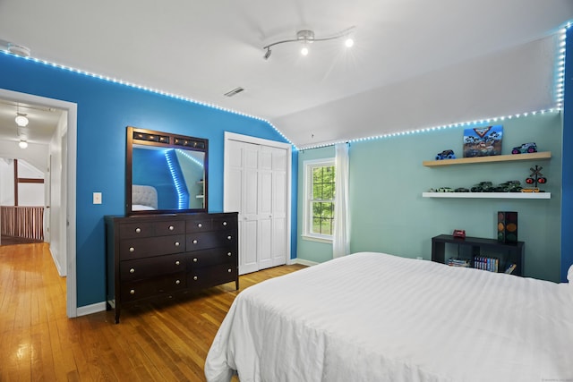 37 Hungry Hill Cir, Guilford, CT 06437 - bedroom with vaulted ceiling, baseboards, wood finished floors, and a closet