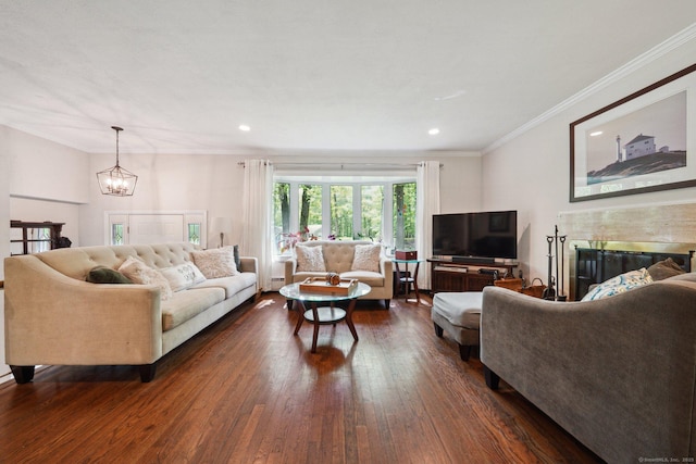 14 Live Oak Rd, Norwalk, CT 06851 - living area featuring a chandelier, dark wood-type flooring, a tile fireplace, ornamental molding, and recessed lighting
