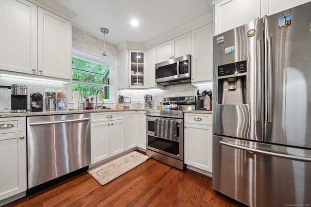 14 Live Oak Rd, Norwalk, CT 06851 - kitchen featuring stainless steel appliances, white cabinetry, tasteful backsplash, dark wood-style floors, and light stone countertops