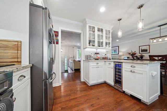 14 Live Oak Rd, Norwalk, CT 06851 - kitchen featuring freestanding refrigerator, a peninsula, wine cooler, crown molding, and dark wood finished floors