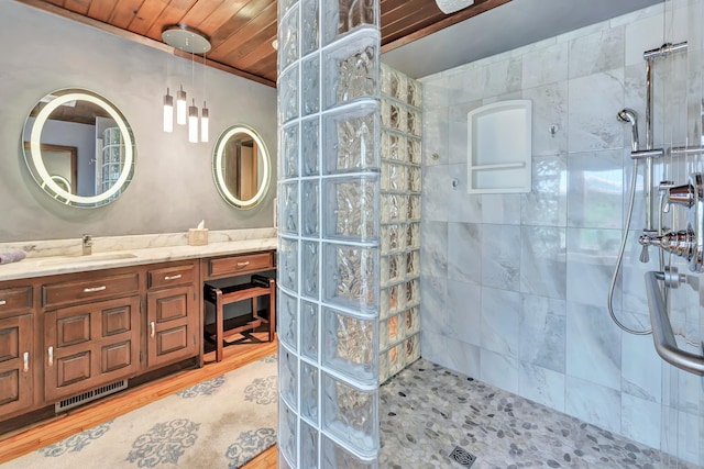 bathroom featuring walk in shower, wooden ceiling, vanity, and wood finished floors